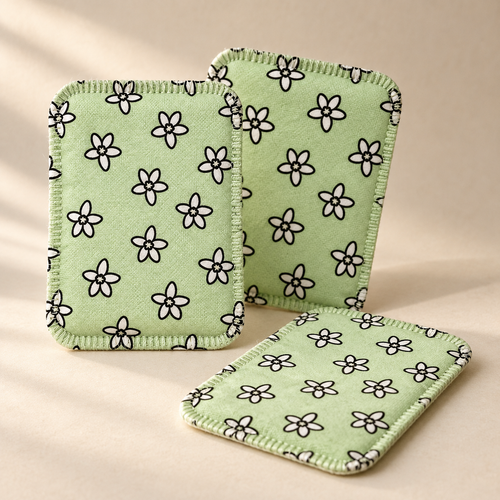 Three CaptureCards, pale green woven fabric with a white flower print and stitched border